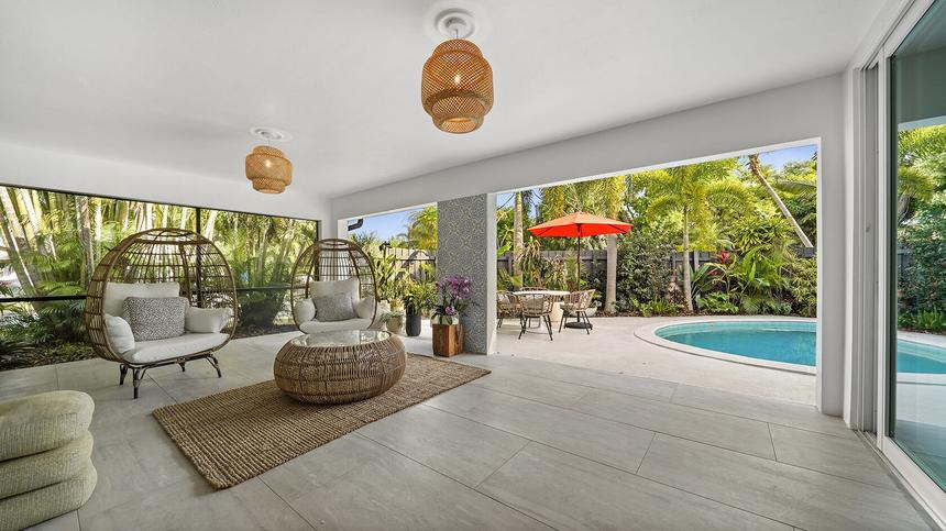 Lanai with pool and seating area