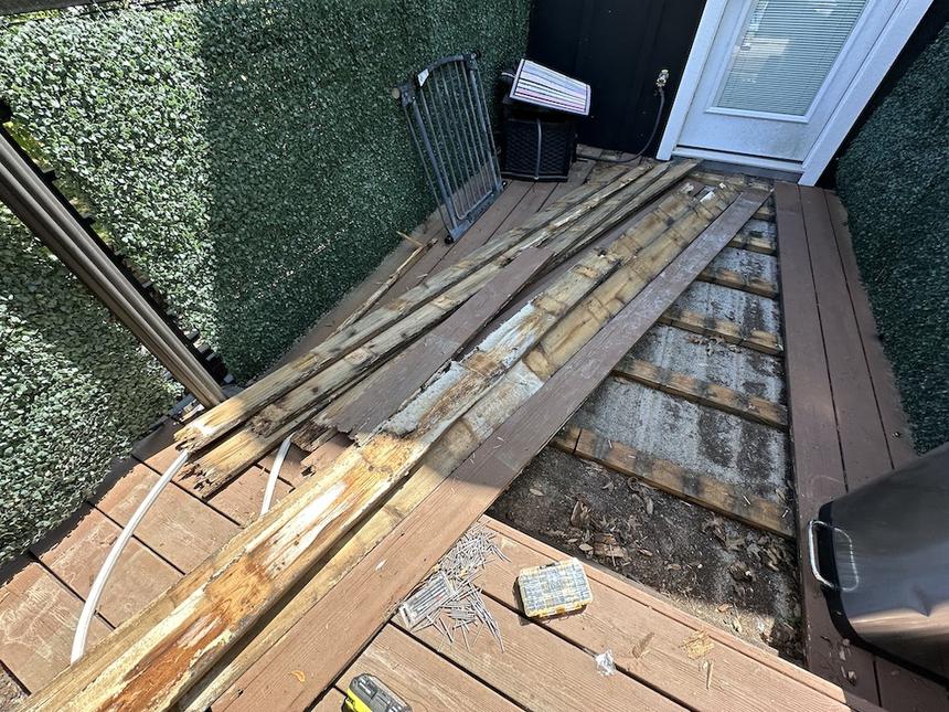 Downtown Austin wood terrace floor repair and painting — before