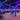 a large group of people inside a pavilion with neon lights during an on location event by VR gamehouse