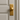 Luxury brass door handle with a gold finish round knob on a classic beige paneled door, perfect for modern and timeless interior designs luxury brass door handle, gold finish door knob, modern interior door hardware, premium door handles, round knob door handle, classic paneled door design, luxury home decor details, high-end hardware fixtures, gold door accessories
