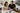 Auckland kitchen renovation consultation with homeowner reviewing layout plans and material samples