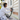 Painter sanding weatherboard cladding during exterior surface preparation in Auckland