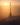 Atmosférický exteriérový render z vysokého úhlu, zobrazující siluetu Ještědské věže zahalenou ve zlatavém oparu se sluncem nízko na obloze.