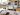 Kitchen renovation cost estimate in Auckland with plans, calculator, laptop and material selections