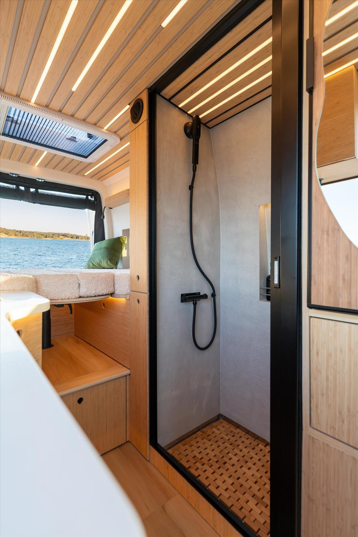 Enclosed indoor shower in a Tiny Planet van