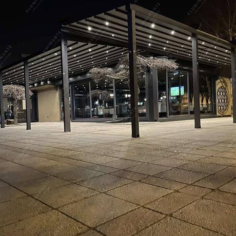 Café summer terrace with retractable pergolas