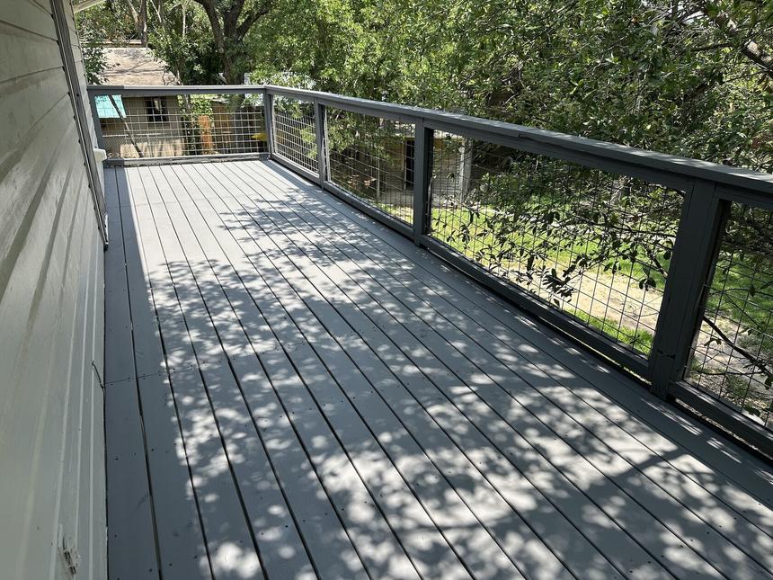 Finished two-level deck after repaint Lakeway TX
