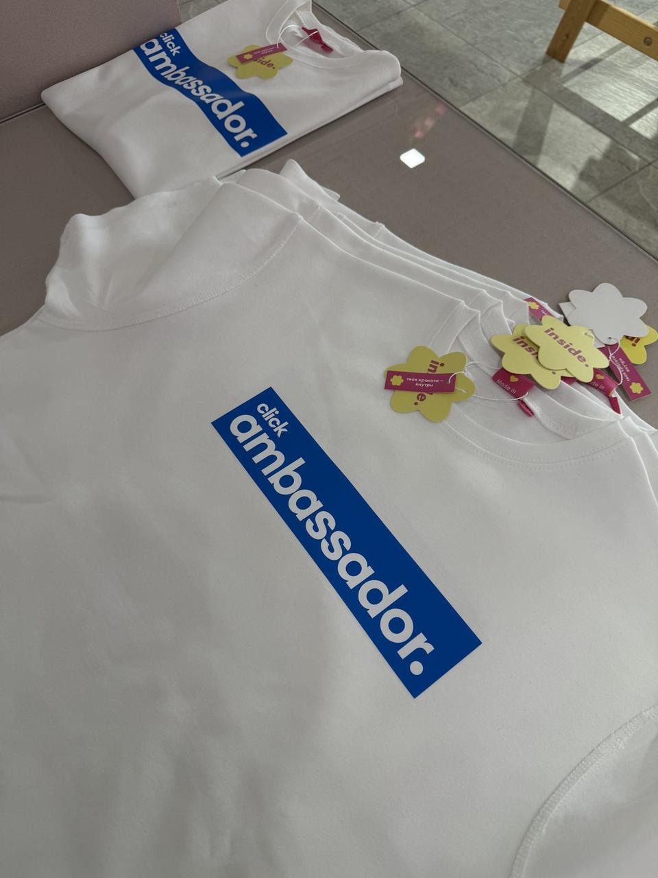 White T-shirts with a blue click ambassador print and Inside Tech labels