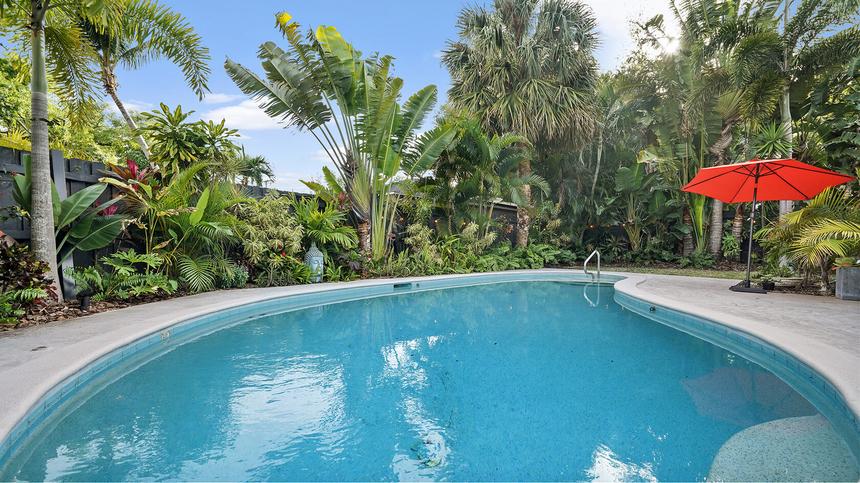 Pool and outdoor seating of a vacation rental home