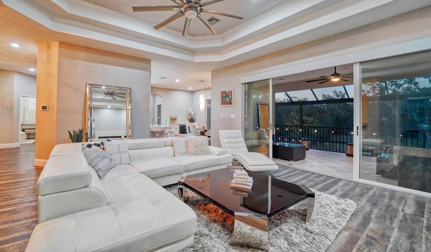 Living room of a rental home opening to a lanai