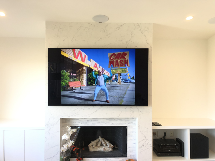 Television mounted on marble wall