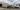Low flatbed truck transporting oversized custom wood crates for window glass — Argos Crating, GTA