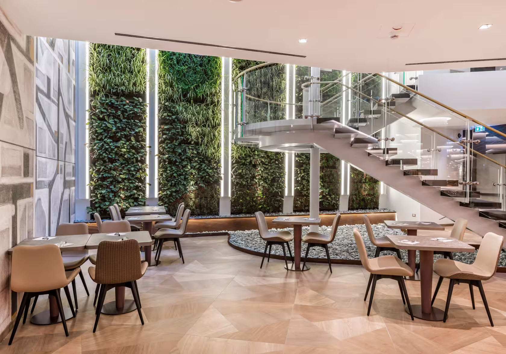 Durable restaurant furniture and finishes: wooden tables, metal chair frames and upholstered seating