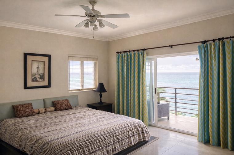 Private bedroom with ocean-view balcony
