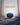 Legacy – oval navy-blue gemstone on a misty path between bare trees, Triple L Collection