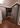 Diagonal view of farm house style mudroom cabinets with built-in bench in dark grey color