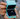 Photographer discreetly capturing a proposal on a rooftop terrace