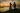 Engagement photo during sunset with dramatic sky