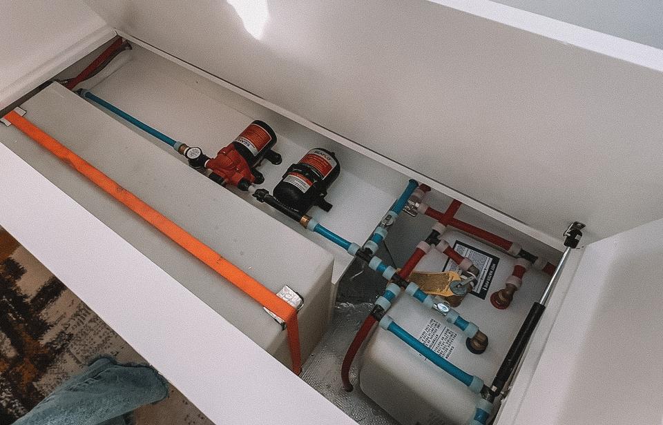 Water lines and pumps installed under the floor