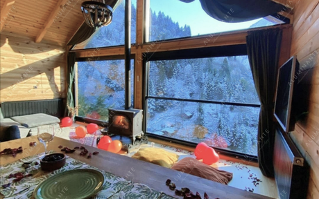 Swiss hotel panoramic window with automatic guillotine glazing