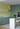 Rendu 3D d’une cuisine colorée avec mobilier sur mesure vert et jaune