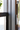 Black aluminium sash profile with circular handle fastener and glazing detail