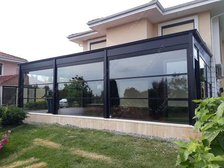 House terrace with SKYLINE guillotine glazing and VISTA retractable roof