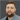 a white man in a gray jacket