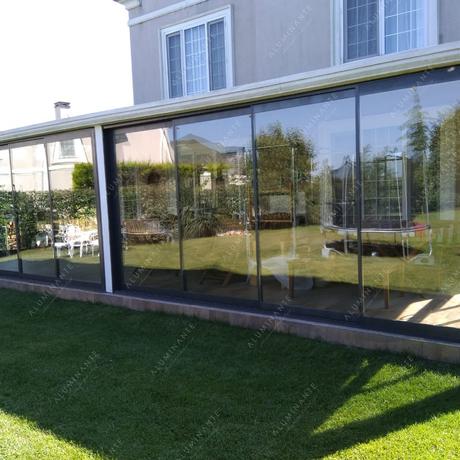 Terrace with warm panoramic sliding double glazing