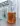 Glass beaker containing amber mushroom coffee liquid extract on a laboratory bench