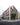 Dynamic 3D visualization showcasing a sharp corner view of a modern grey brick residential building with large windows, wooden frames, terraced top floors, and people walking on the sidewalk.