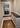 Mudroom storage cabinet with large hall mirror and built-in bench