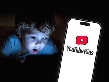 Toddler watching YouTube Kids on a phone in a dark room