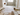 Bathroom renovation planning in Auckland with floor plans, tile samples, tapware and measuring tools