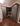 Diagonal view of farm house style mudroom cabinets with built-in bench in dark grey color