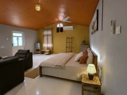The Tack Room bedroom and sitting area for riding-holiday guests at Vonfidel Ranch.
