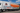 Refrigerated transport truck at a modern logistics warehouse