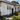 Professional exterior cleaning of a weatherboard home before painting in Auckland